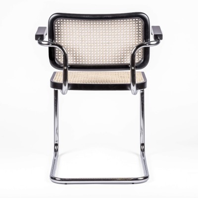 Replica of the Cesca Chair with armrests by designer Marcel Breuer